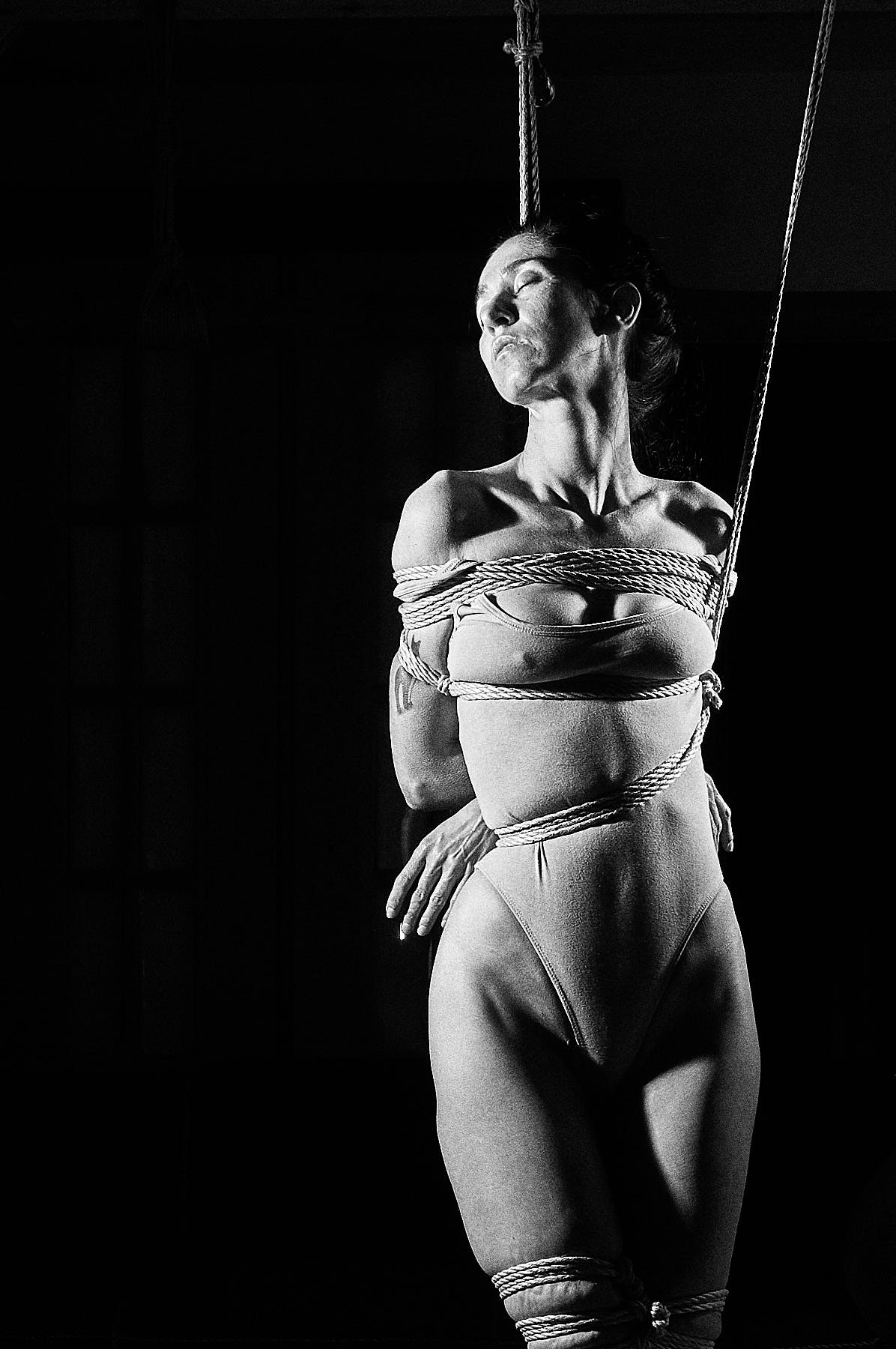 Beautiful woman tied up in traditional Japanese Bondage
