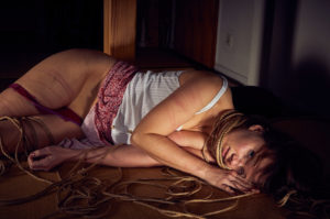 Beautiful woman tied up in traditional Japanese Bondage