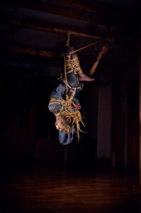 Tattooed woman tied