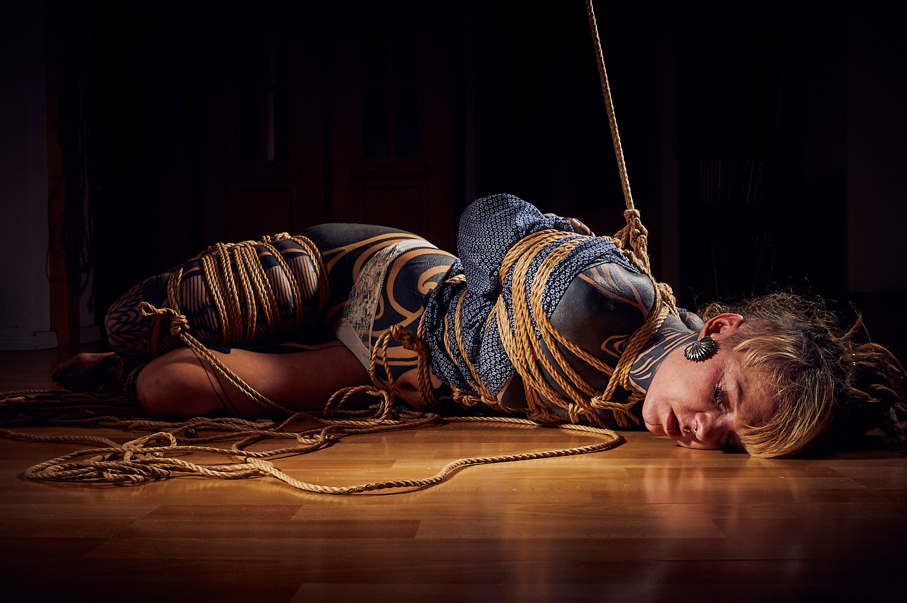 Tattooed woman tied